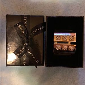 Victoria’s Secret gold sparkle bracelet.